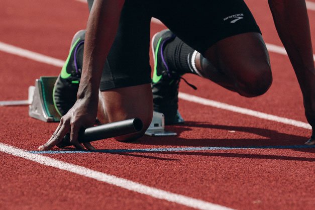 a runner on the starting blocks ready to race