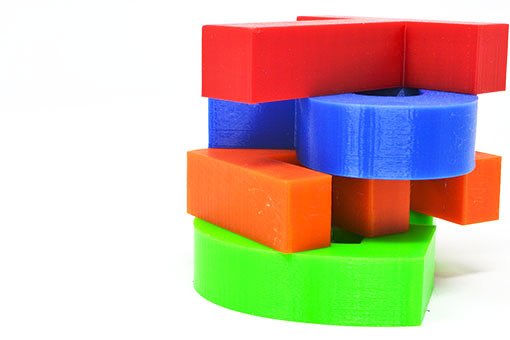 PETG 3d letters stacked a top of each other, in red, blue, orange and green