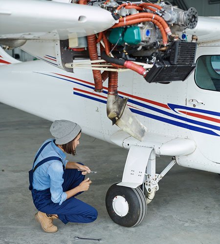 engineer working on vintage seaplane